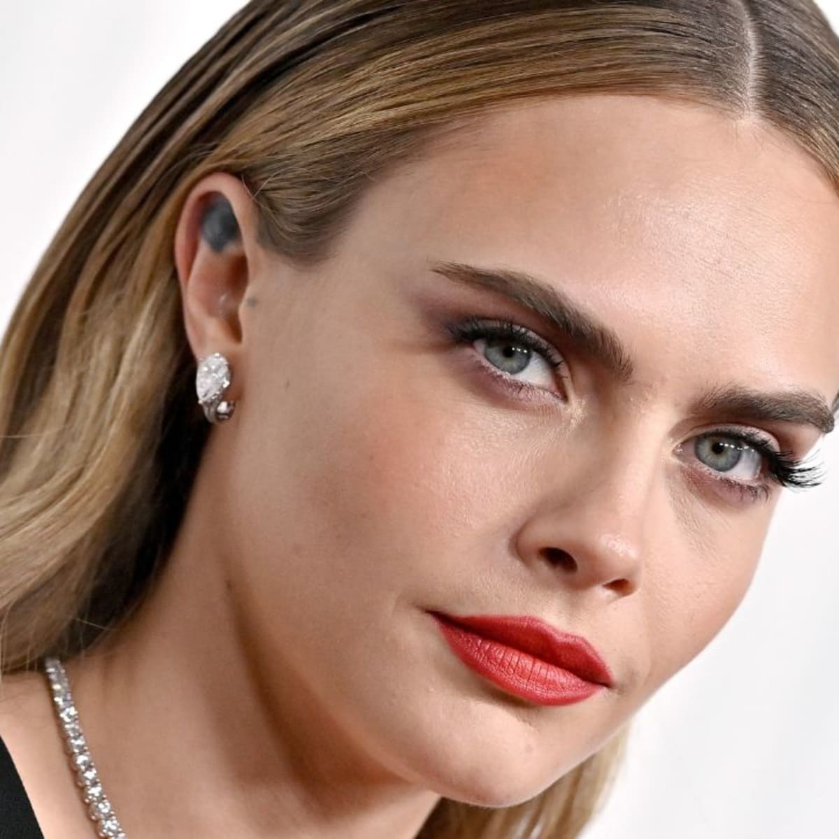 Cara delevingne earrings store