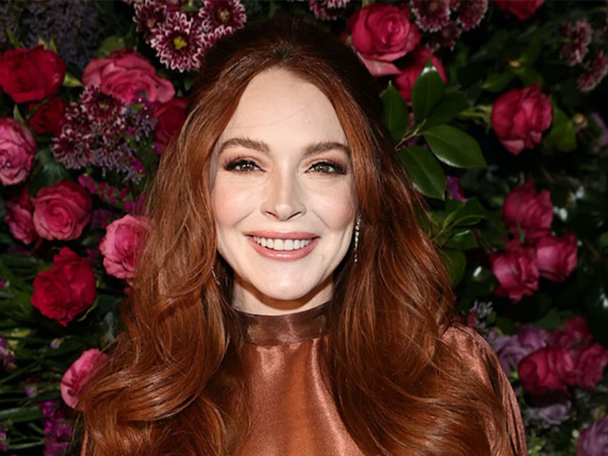 Pregnant Lindsay Lohan Shows Off Bump in Black Bathing Suit