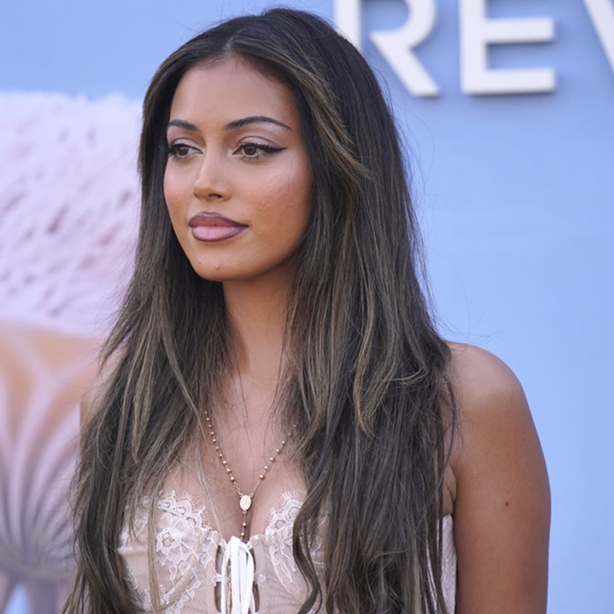 Cindy Kimberly Poses Roadside With a Lollipop, Announces