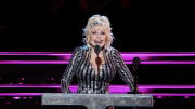 Dolly Parton speaks at the 37th annual Rock & Roll Hall of Fame Induction Ceremony.