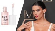 On the left, there is a bottle of Benefit Cosmetics High Beam Highlighter. On the right, Sara Sampaio poses on a red carpet in a white sparkly dress and red lipstick.