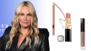 On the left, Molly Sims smiles in a black leather jacket in front of a blue backdrop. On the right, there are three beauty products: a gold Charlotte Tilbury lip pencil, a black and gold tube of Chanel lipstick an d a clear tube of Victoria Beckham’s tan lip gloss.