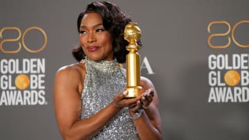 Angela Bassett poses with her Best Supporting Actress in a Motion Picture Golden Globe.