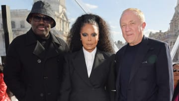(L to R) Editor-In-Chief of British Vogue Edward Enninful, Janet Jackson and Francois-Henri Pinault attend the Alexander McQueen SS23 Womenswear show in England.