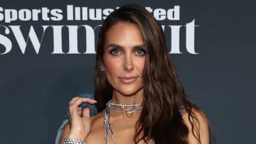 Melissa Wood-Tepperberg poses in a metallic top and diamond necklaces.