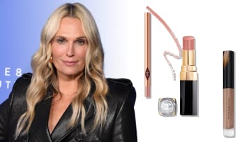 On the left, Molly Sims smiles in a black leather jacket in front of a blue backdrop. On the right, there are three beauty products: a gold Charlotte Tilbury lip pencil, a black and gold tube of Chanel lipstick an d a clear tube of Victoria Beckham’s tan lip gloss.