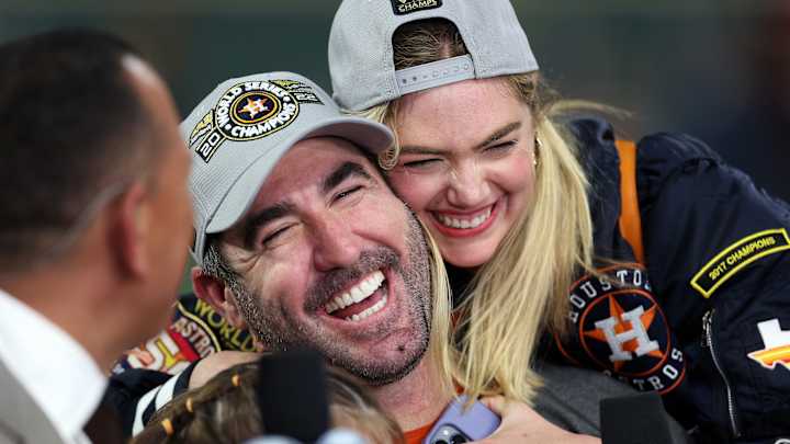 Kate Upton hugs husband Justin Verlander as the Houston pitcher does a postgame interview following the Astros’ World Series win. Kate Upton hugs husband Justin Verlander as the Houston pitcher does a postgame interview following the Astros’ World Series win.