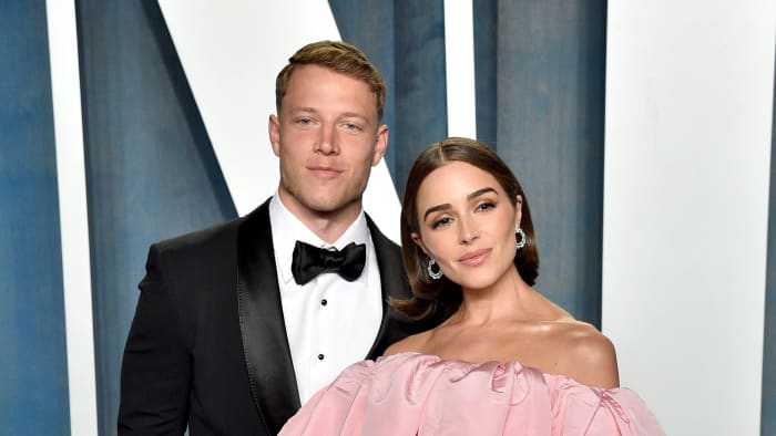 Olivia Culpo and Christian McCaffrey attend the 2022 Vanity Fair Oscar Party.