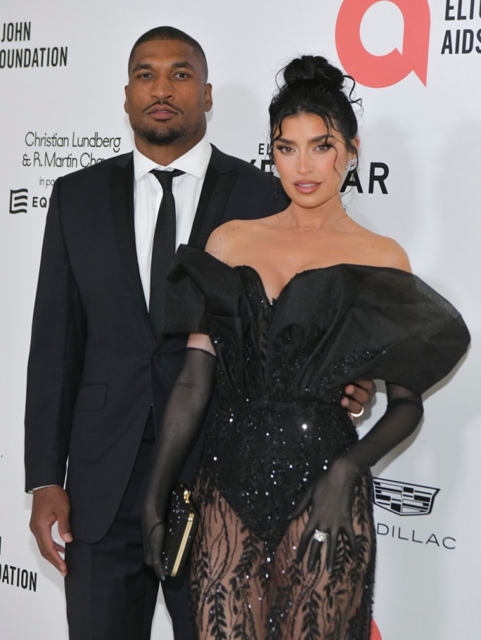 Larry English and Nicole Williams English attend Elton John AIDS Foundation's 30th Annual Academy Awards Viewing Party.