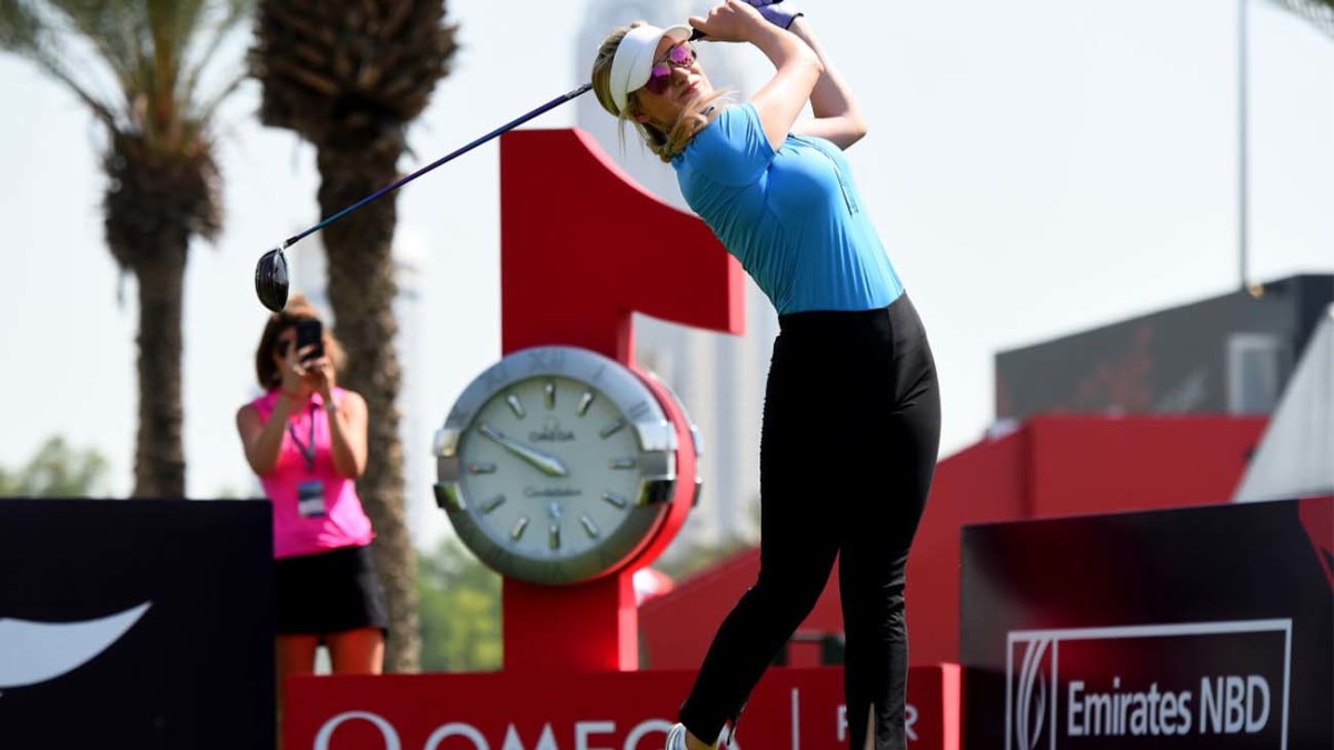 Paige Spiranac of United States tees off from the 1st hole during Day Three of the Omega Dubai Moonlight Classic at Emirates Golf Club in Dubai, United Arab Emirates.
