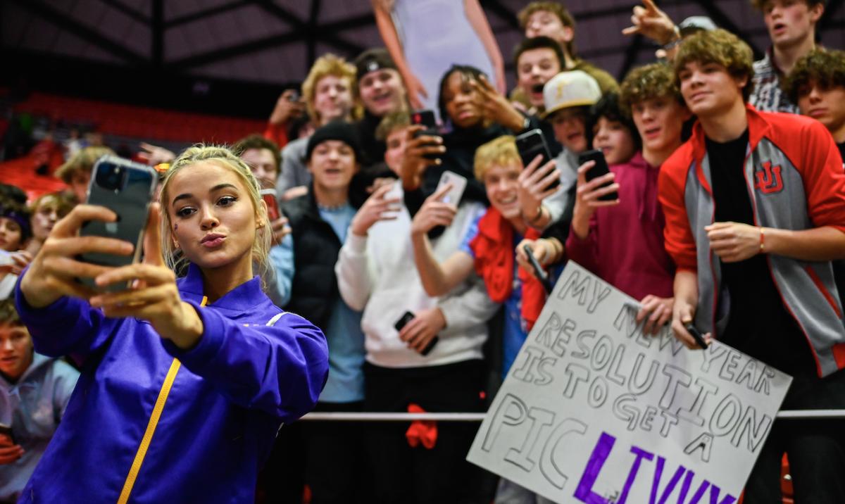 Olivia Dunne takes a selfie with fans after a Pac-12 meet against Utah on Jan. 6.