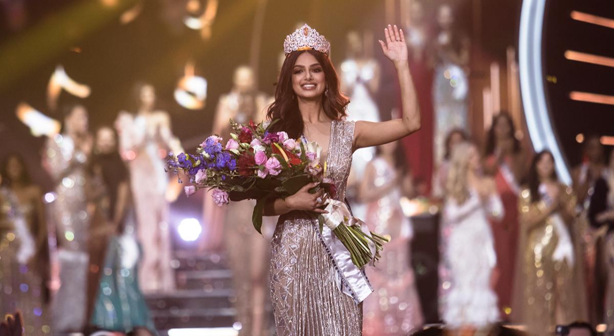 Miss Universe Harnaaz Sandhu of India waves onstage at the 70th Miss Universe competition.