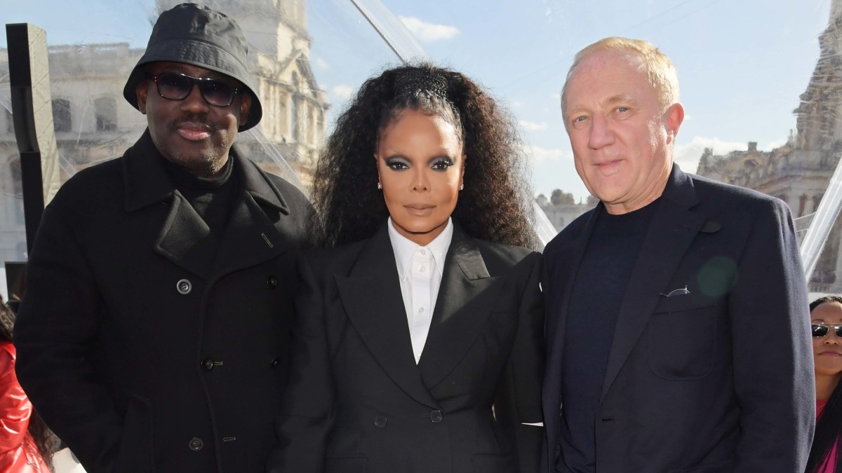 (L to R) Editor-In-Chief of British Vogue Edward Enninful, Janet Jackson and Francois-Henri Pinault attend the Alexander McQueen SS23 Womenswear show in England.