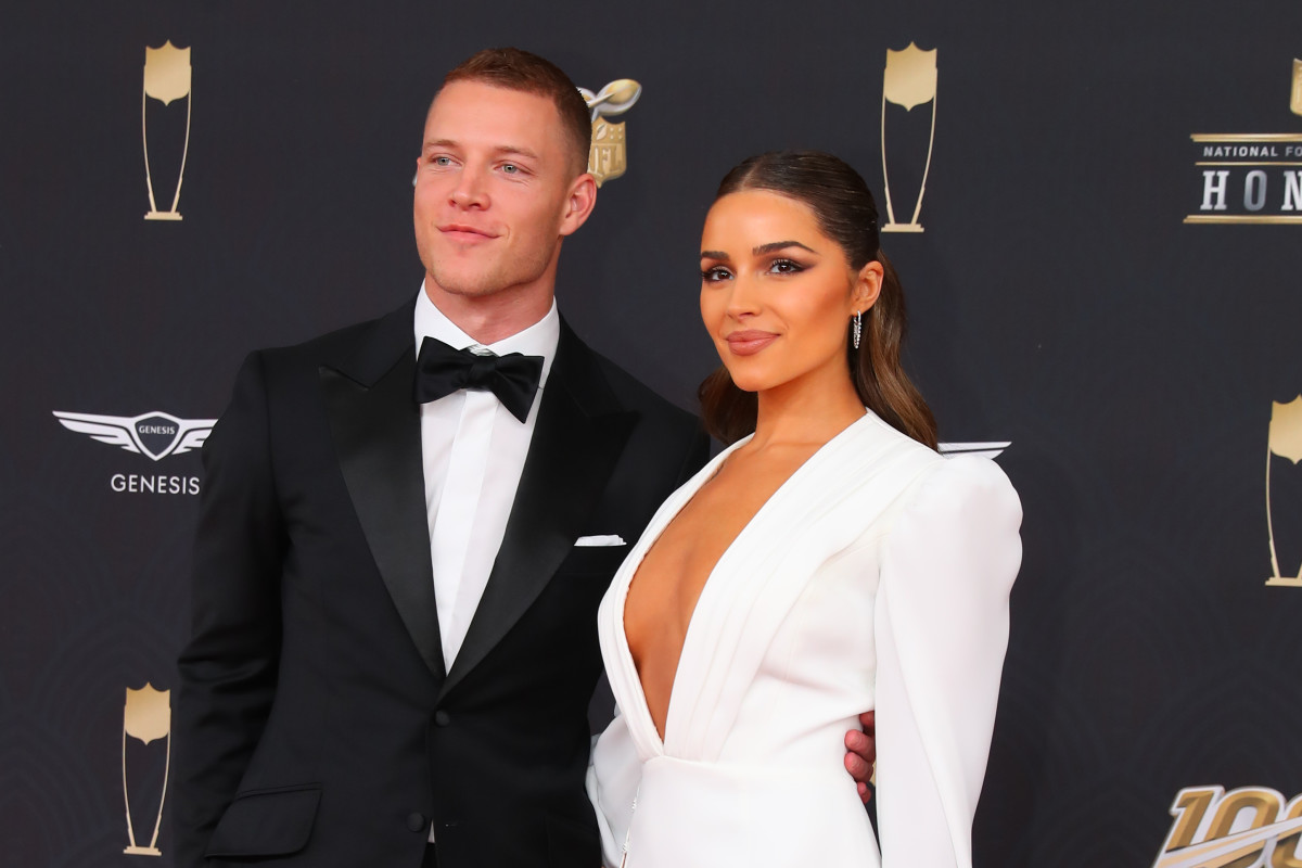 Christian McCaffrey and Olivia Culpo pose on the red carpet prior to the NFL Honors event.