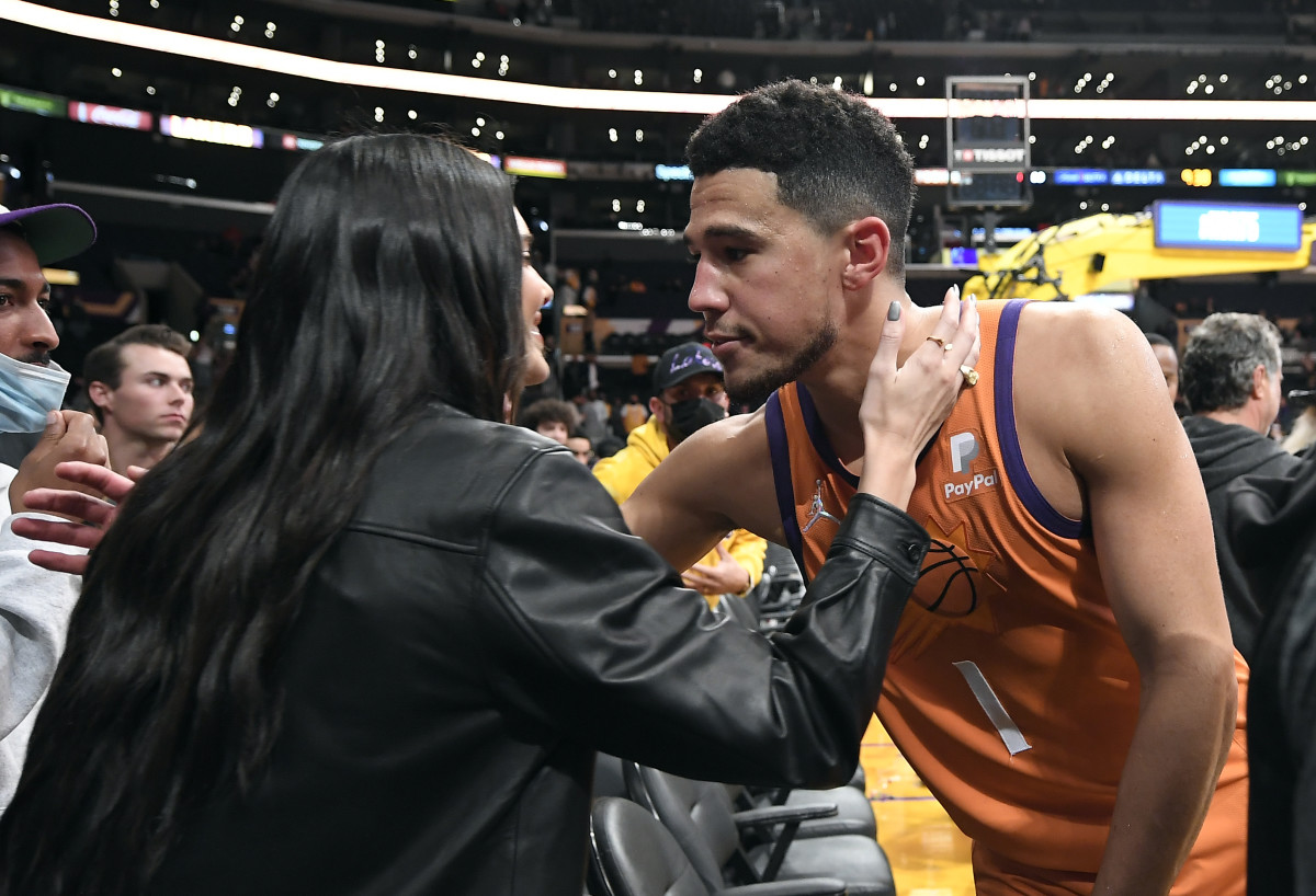 Jenner and Booker hug after the Suns defeated the Lakers at Staples Center.