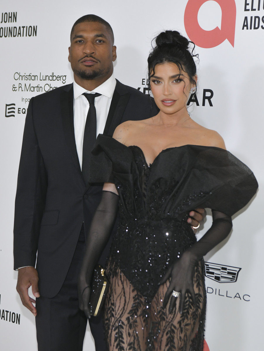 Larry English and Nicole Williams English attend Elton John AIDS Foundation's 30th Annual Academy Awards Viewing Party.