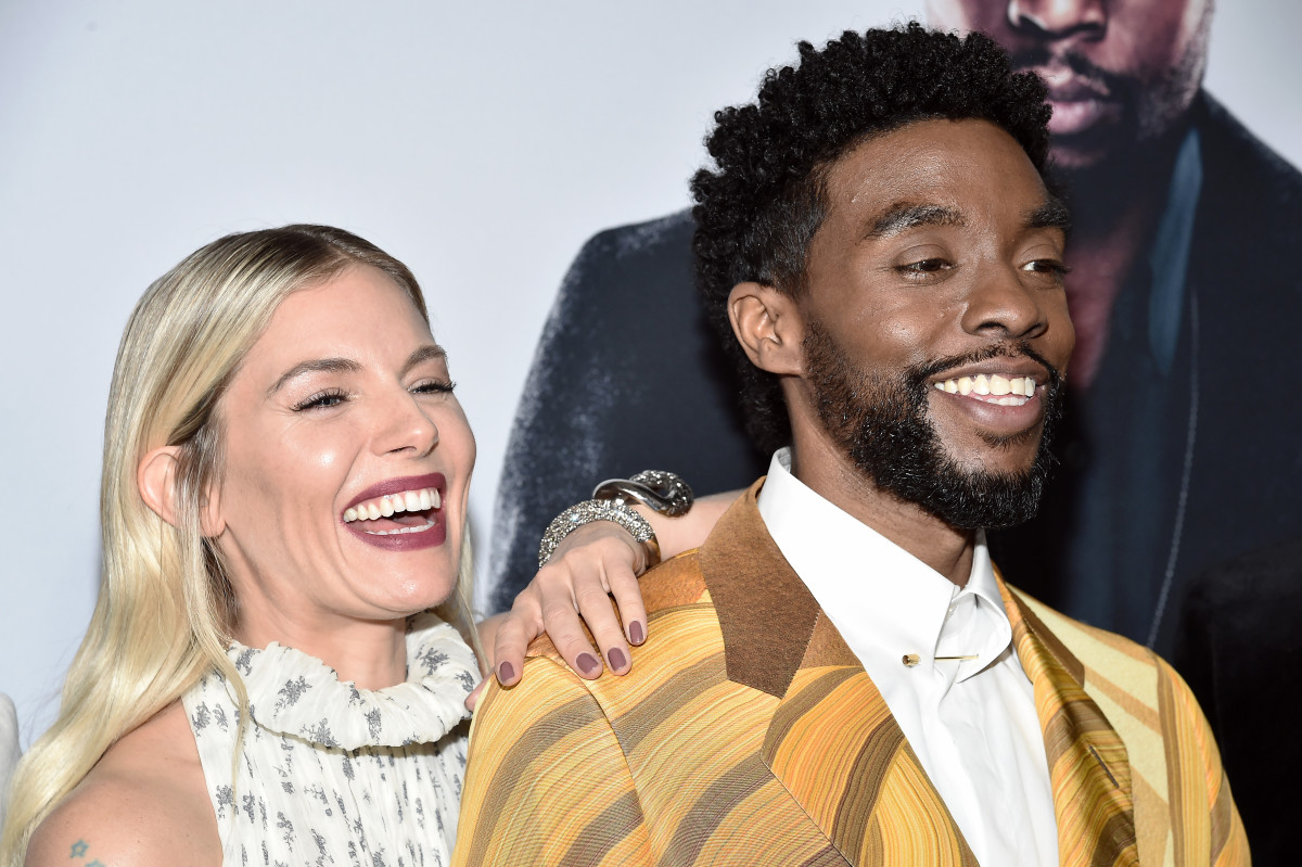 Sienna Miller and Chadwick Boseman attend a screening of “21 Bridges" in New York City.